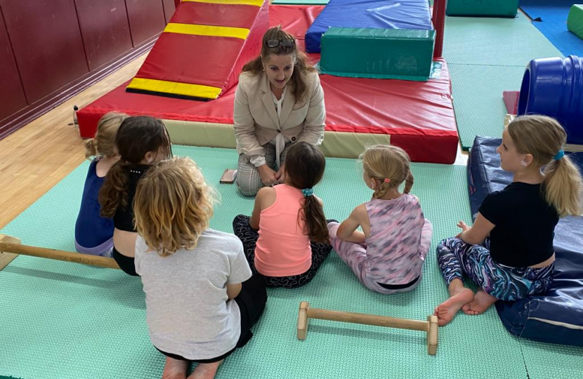 MP Caroline Ansell with a group of young children at Meads Sports Centre