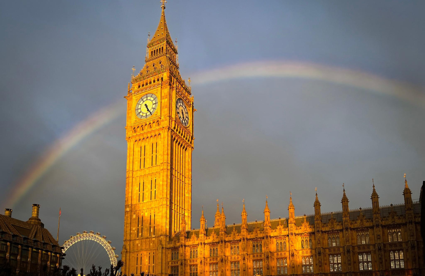 Photograph depicting a rainbow over Parliament