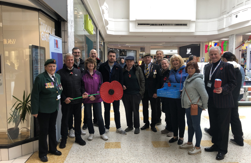 Poppy selling Conservative Councillors and volunteers. Beacon, Eastbourne Town Centre