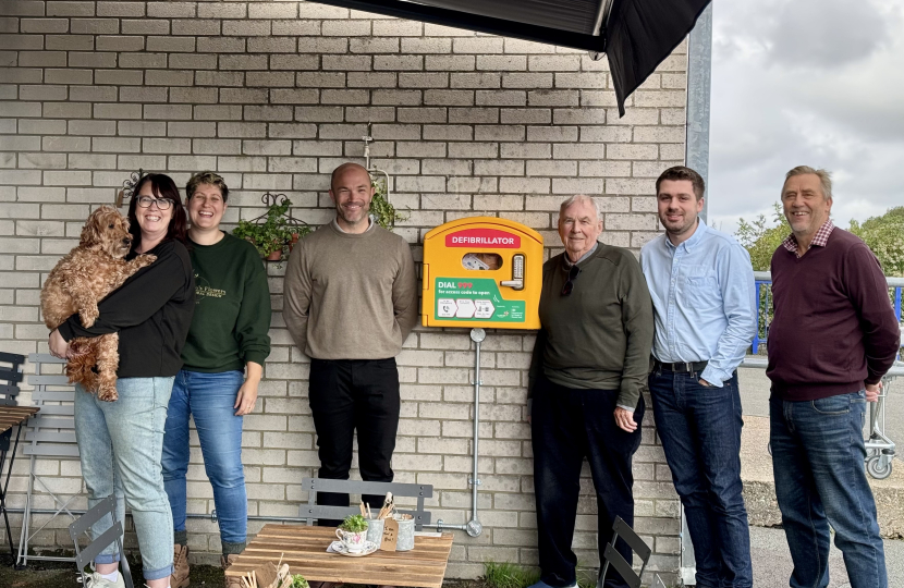 Image of Cllr Colin Belsey, Cllr David Small, Cllr Nick Ansell and others pictured with the new defibrillator in Framfield Way Ratton. 