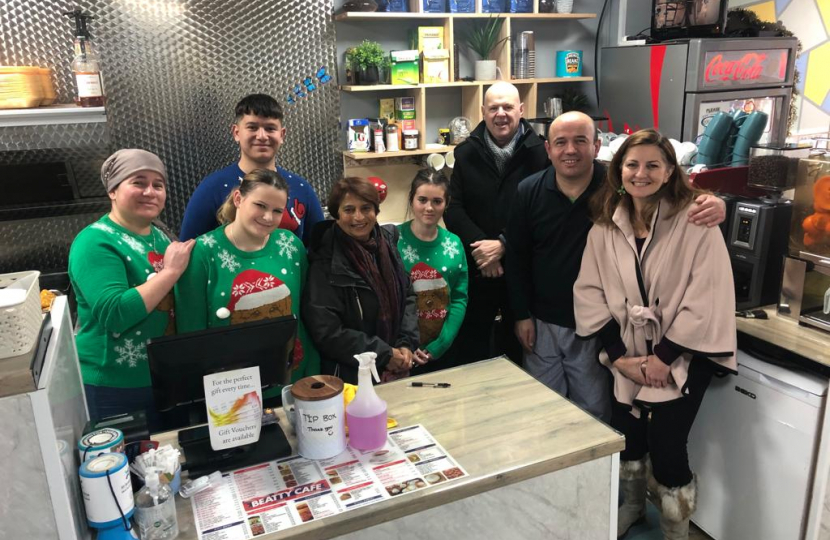 Caroline Ansell MP, Cllrs Kshama Shore and Nigel Goodyear inside Beatty Cafe, Beaty Rd. Pictured with staff in Christmas sweaters. Sovereign ward. 