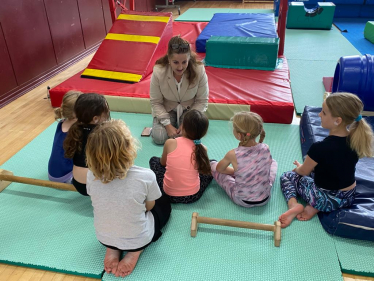 MP Caroline Ansell with a group of young children at Meads Sports Centre