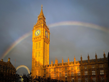 Photograph depicting a rainbow over Parliament