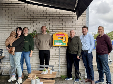 Image of Cllr Colin Belsey, Cllr David Small, Cllr Nick Ansell and others pictured with the new defibrillator in Framfield Way Ratton. 